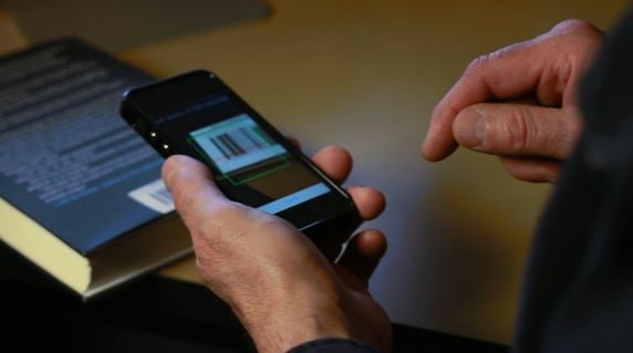 This Estel Tech Anywhere/HTML5 application is scanning a barcode to retrieve information about a book. Estel Tech Anywhere simplifies the building of these kinds of applications, while Adobe PhoneGap gives the app the ability to access device hardware, in this case the camera.
