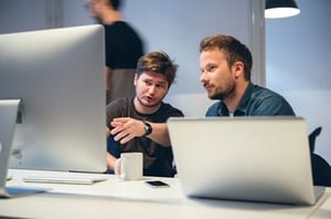 Two Low-Code and No-Code Developers Sitting at a Computer | Estel Tech