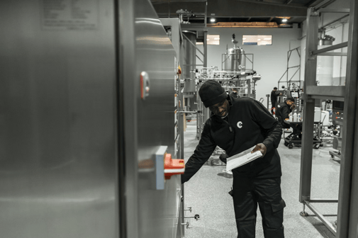 A man inspecting equipment and collecting data